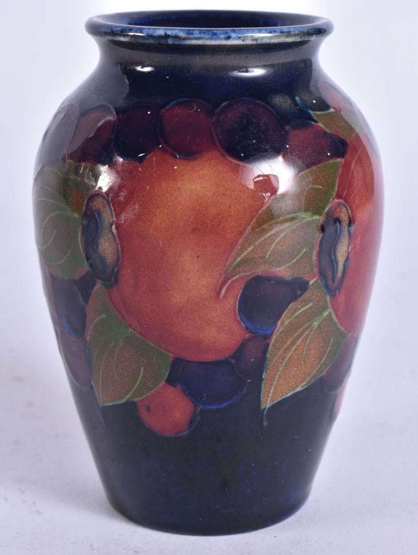 A SMALL MOORCROFT VASE. 9 cm high. (1 of 5)