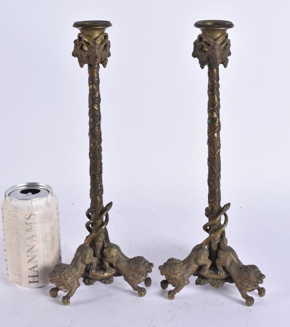 A PAIR OF 19TH CENTURY EUROPEAN GRAND TOUR BRONZE CANDLESTICKS formed with vines and lions. 31 cm hi: A PAIR OF 19TH CENTURY EUROPEAN GRAND TOUR BRONZE CANDLESTICKS formed with vines and lions. 31 cm high.