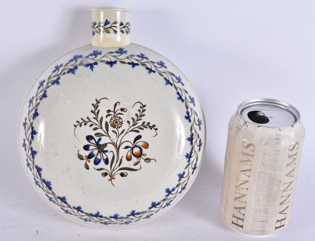 A RARE 18TH/19TH CENTURY ENGLISH POTTERY CIRCULAR FLASK painted with flowers. 22 cm x 14cm.: A RARE 18TH/19TH CENTURY ENGLISH POTTERY CIRCULAR FLASK painted with flowers. 22 cm x 14cm.