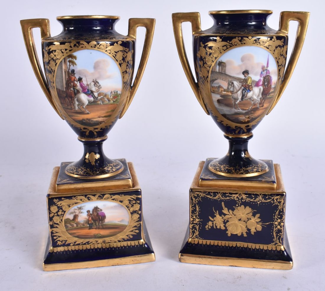 A PAIR OF ANTIQUE VIENNA PORCELAIN TWIN HANDLED VASES painted with figures on horses. 17.5 cm high. (1 of 9)