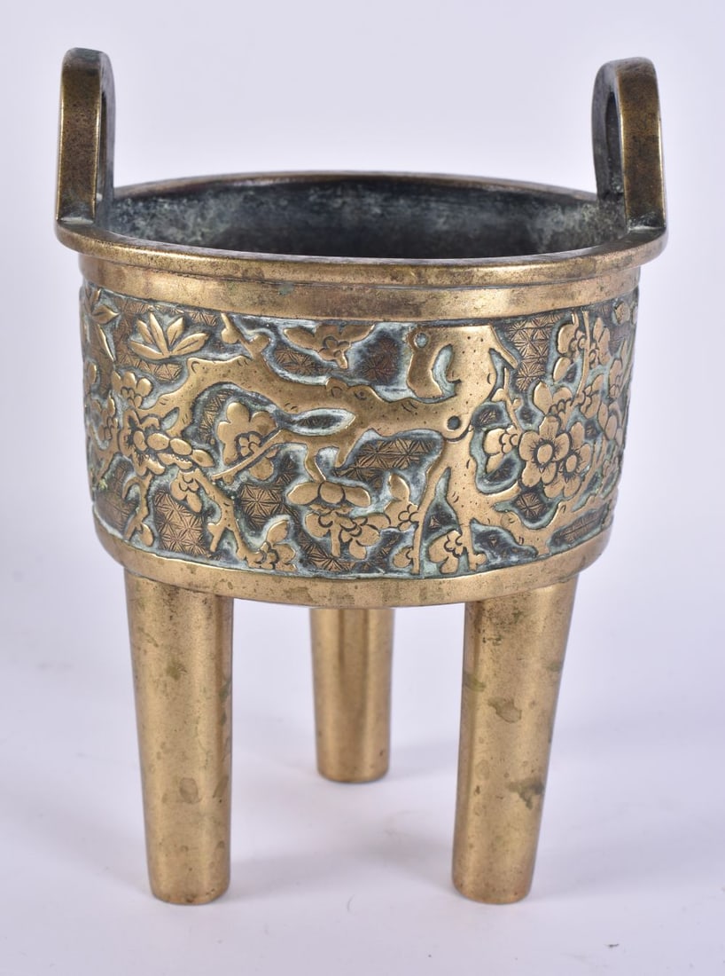 AN 18TH CENTURY CHINESE TWIN HANDLED RAISED FOOT BRONZE CENSER bearing Xuande marks to base, decorat (1 of 15)