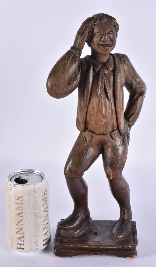 AN ANTIQUE FOLK ART CARVED WOOD FIGURE OF A DANDY. 35 cm high.: AN ANTIQUE FOLK ART CARVED WOOD FIGURE OF A DANDY. 35 cm high.