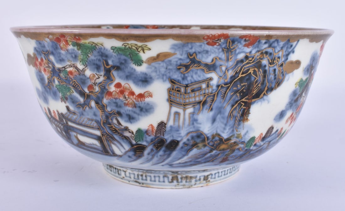 AN 18TH/19TH CENTURY JAPANESE EDO PERIOD IMARI BLUE AND WHITE PORCELAIN BOWL painted with dragons an: AN 18TH/19TH CENTURY JAPANESE EDO PERIOD IMARI BLUE AND WHITE PORCELAIN BOWL painted with dragons and landscapes. 21 cm diameter.