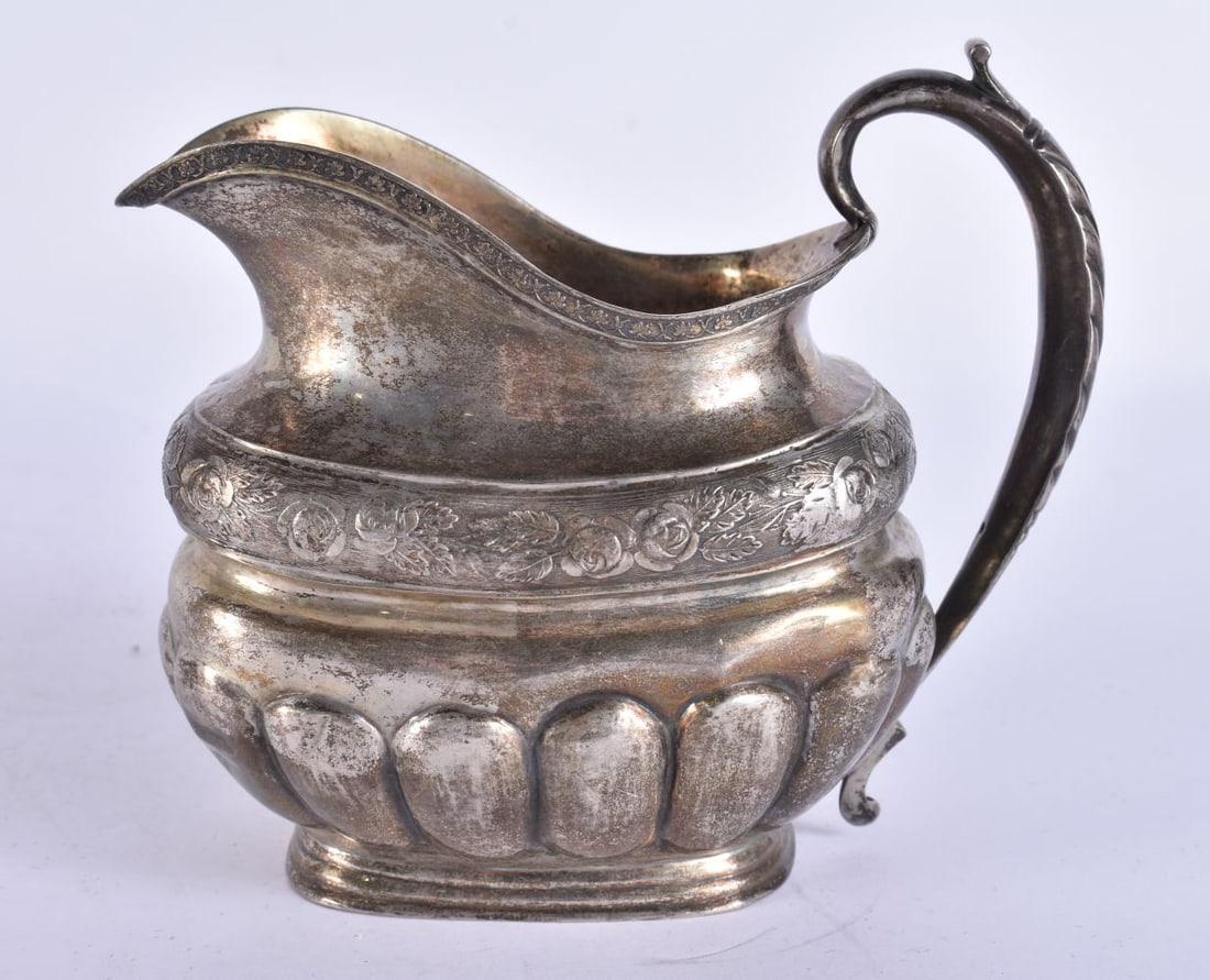 AN ANTIQUE RUSSIAN CREAM JUG. 164 grams. 12.5 cm wide.: AN ANTIQUE RUSSIAN CREAM JUG. 164 grams. 12.5 cm wide.