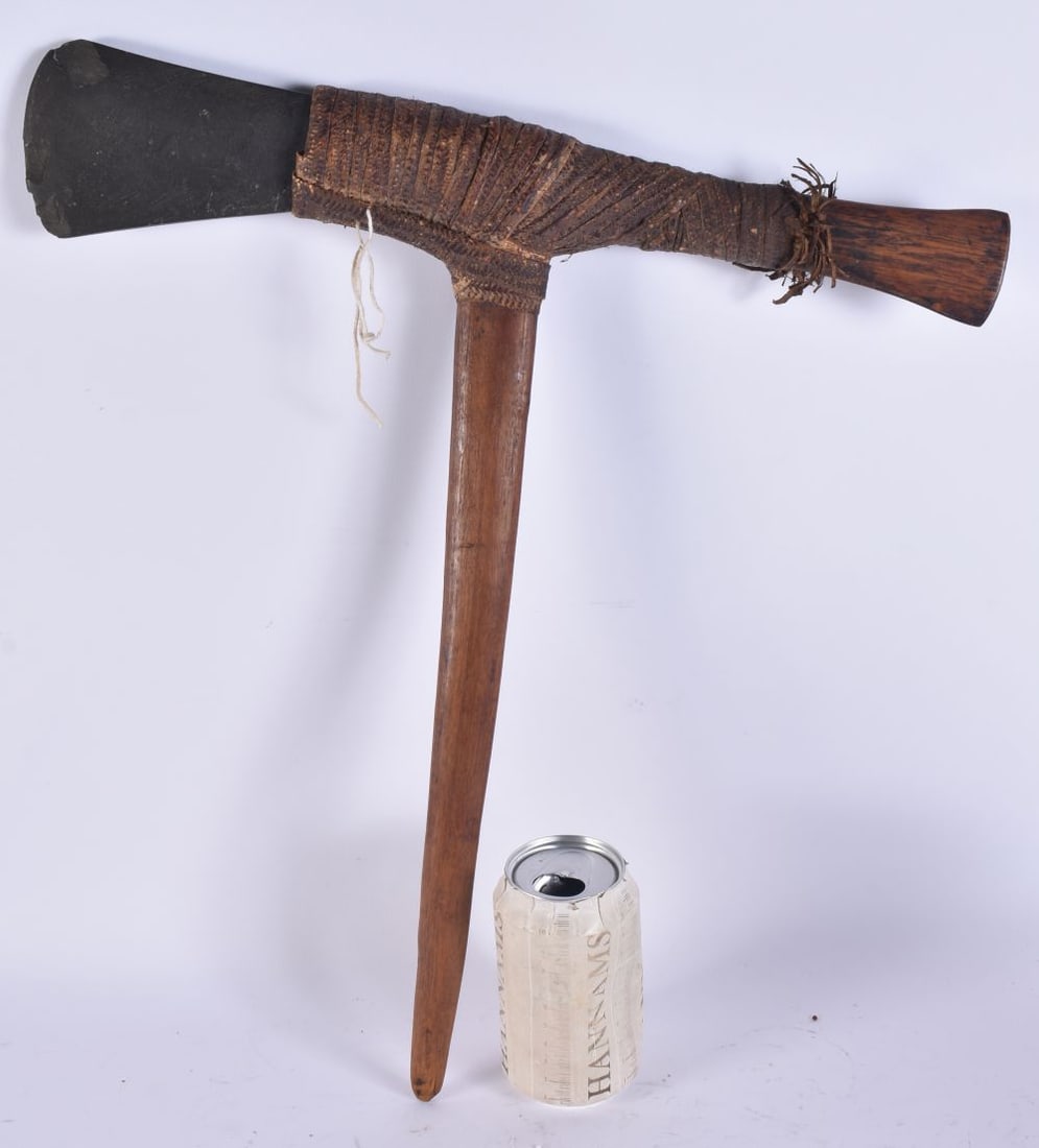 A TRIBAL WICKER BOUND ADZE AXE. 44 cm x 34 cm. (1 of 4)