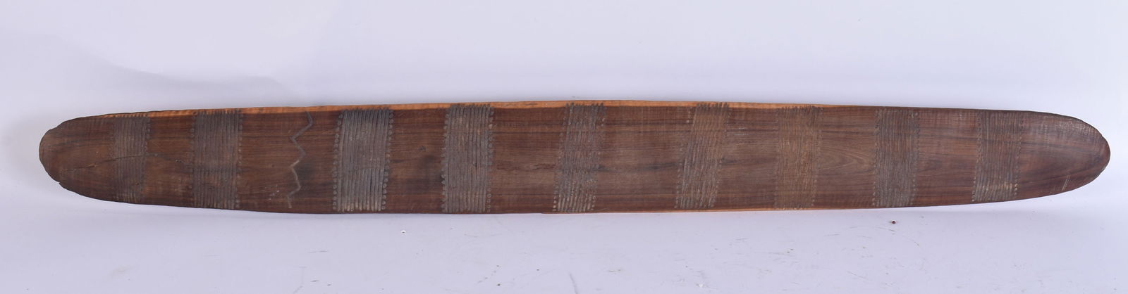AN AUSTRALIAN ABORIGINAL TRIBAL CARVED WOOD PARRYING SHIELD. 74 cm long. (1 of 5)