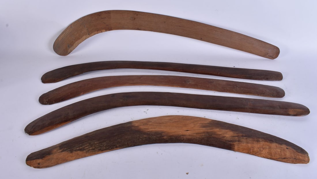 FIVE AUSTRALIAN TRIBAL ABORIGINAL CARVED WOOD BOOMERANGS. Largest 72 cm wide. (4): FIVE AUSTRALIAN TRIBAL ABORIGINAL CARVED WOOD BOOMERANGS. Largest 72 cm wide. (4)
