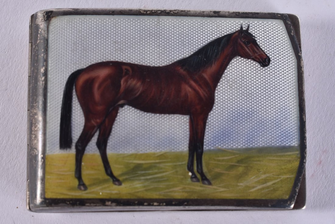 AN ART DECO GERMAN SILVER AND ENAMEL EQUESTRIAN BOX painted with a horse. 44 cm wide. 5.75 cm x 4 cm: AN ART DECO GERMAN SILVER AND ENAMEL EQUESTRIAN BOX painted with a horse. 44 cm wide. 5.75 cm x 4 cm.