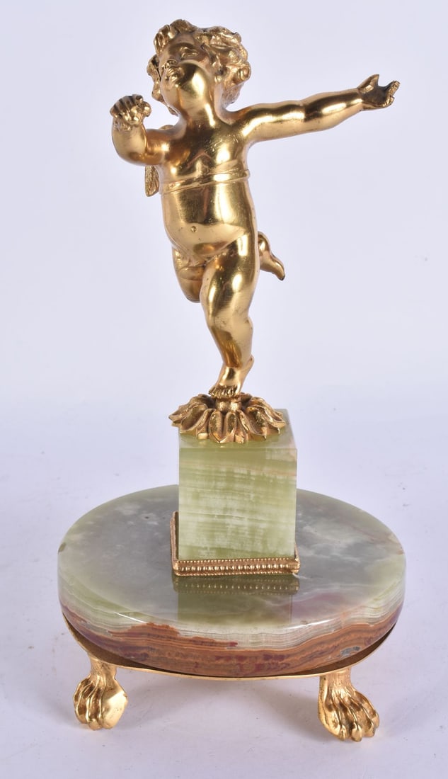 AN ANTIQUE FRENCH ONYX GILT BRONZE FIGURE OF A PUTTI. 25 cm high.: AN ANTIQUE FRENCH ONYX GILT BRONZE FIGURE OF A PUTTI. 25 cm high.