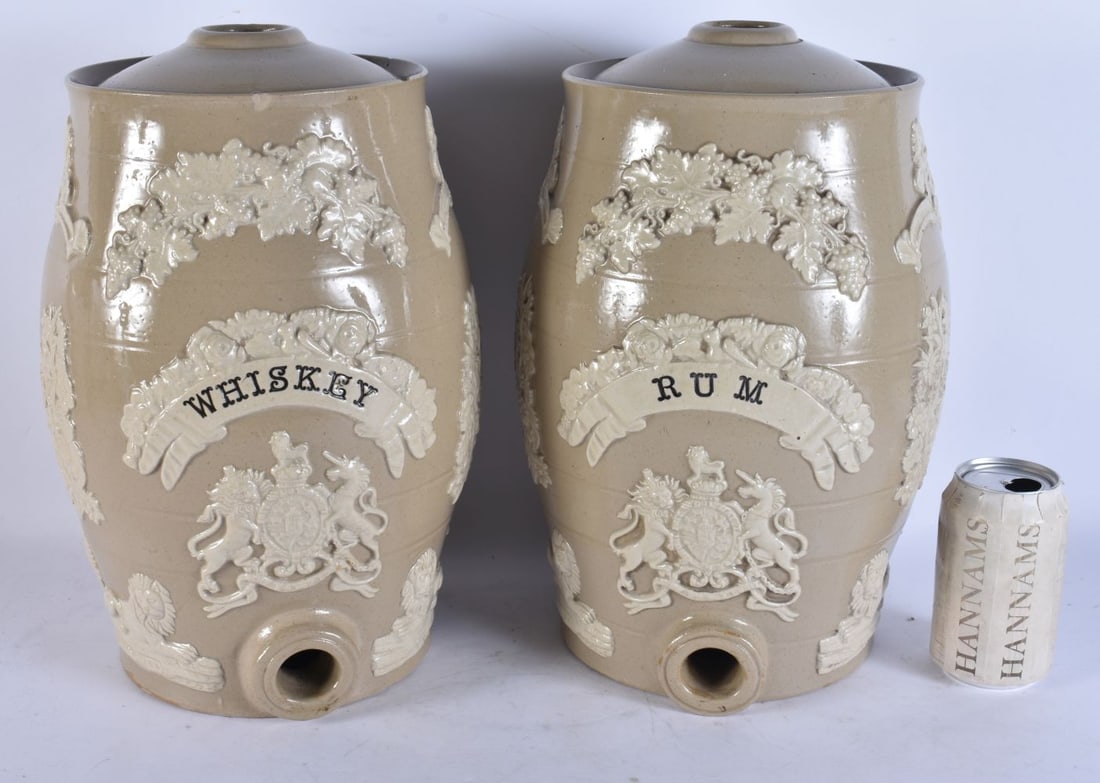 A PAIR OF VICTORIAN SALT GLAZED POTTERY WHISKEY AND RUM DECANTERS. 34 cm x 17 cm. (1 of 5)
