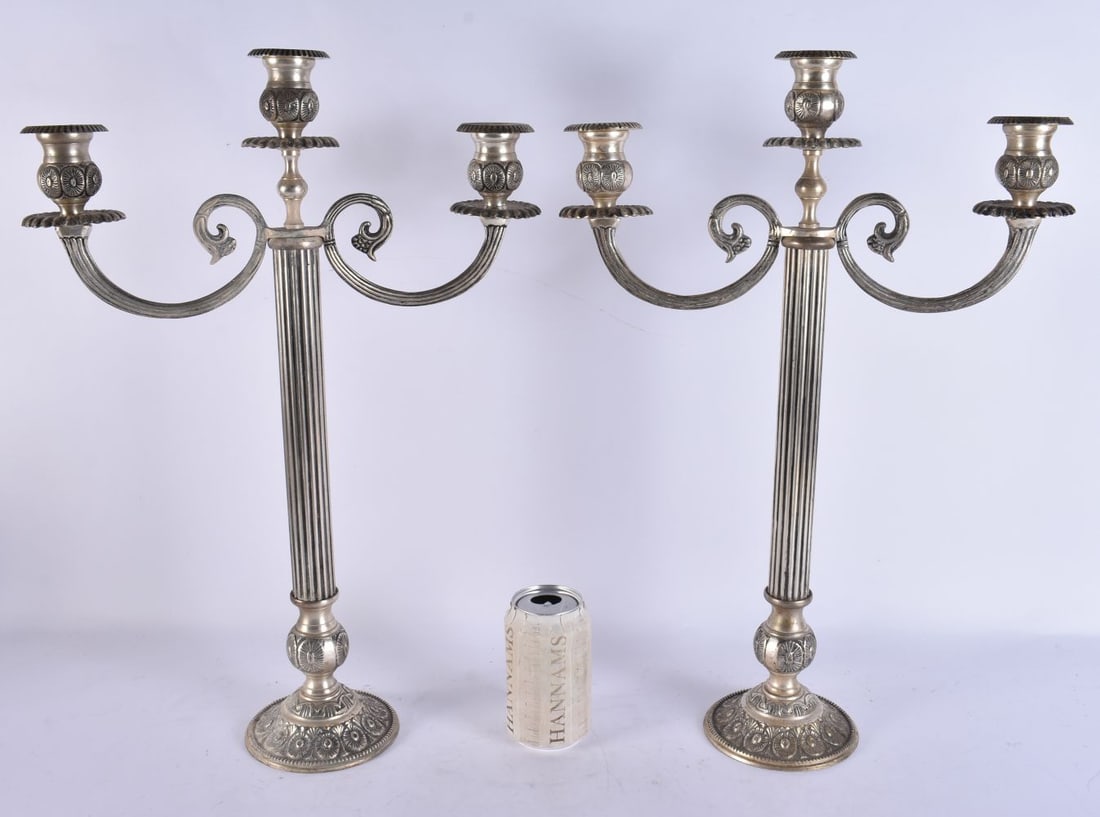 A PAIR OF SILVER PLATED CANDLESTICKS. 50 cm x 30 cm. (1 of 6)
