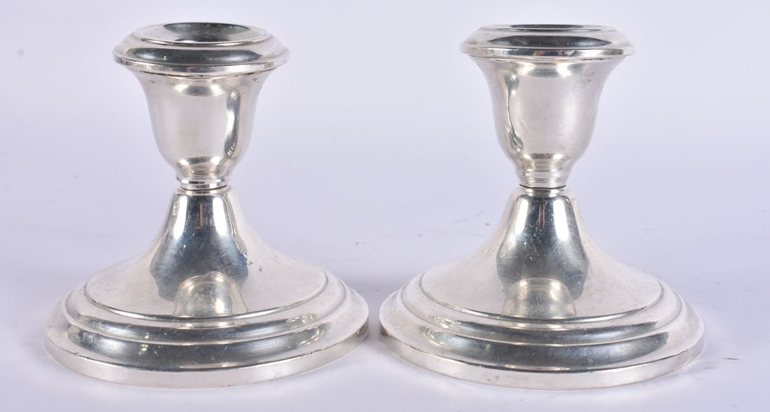 A PAIR OF SILVER CANDLESTICKS. 663 grams. 8 cm high. (1 of 5)