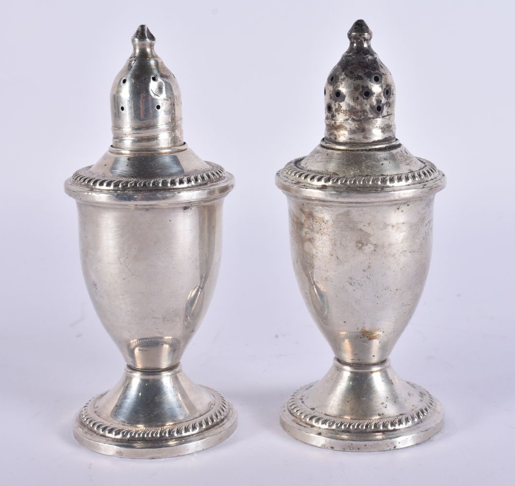 A PAIR OF SILVER CONDIMENTS. 261 grams overall. 11.5 cm high. (1 of 4)