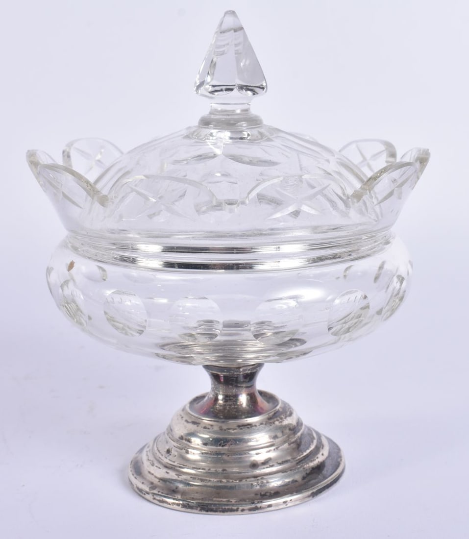 A SILVER FOOT GLASS JAR AND COVER. 9 cm high.: A SILVER FOOT GLASS JAR AND COVER. 9 cm high.