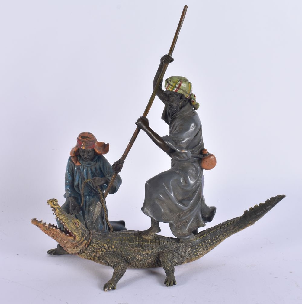 A COLD PAINTED BRONZE ALLIGATOR HUNTING FIGURE. 22 cm x 16 cm.: A COLD PAINTED BRONZE ALLIGATOR HUNTING FIGURE. 22 cm x 16 cm.