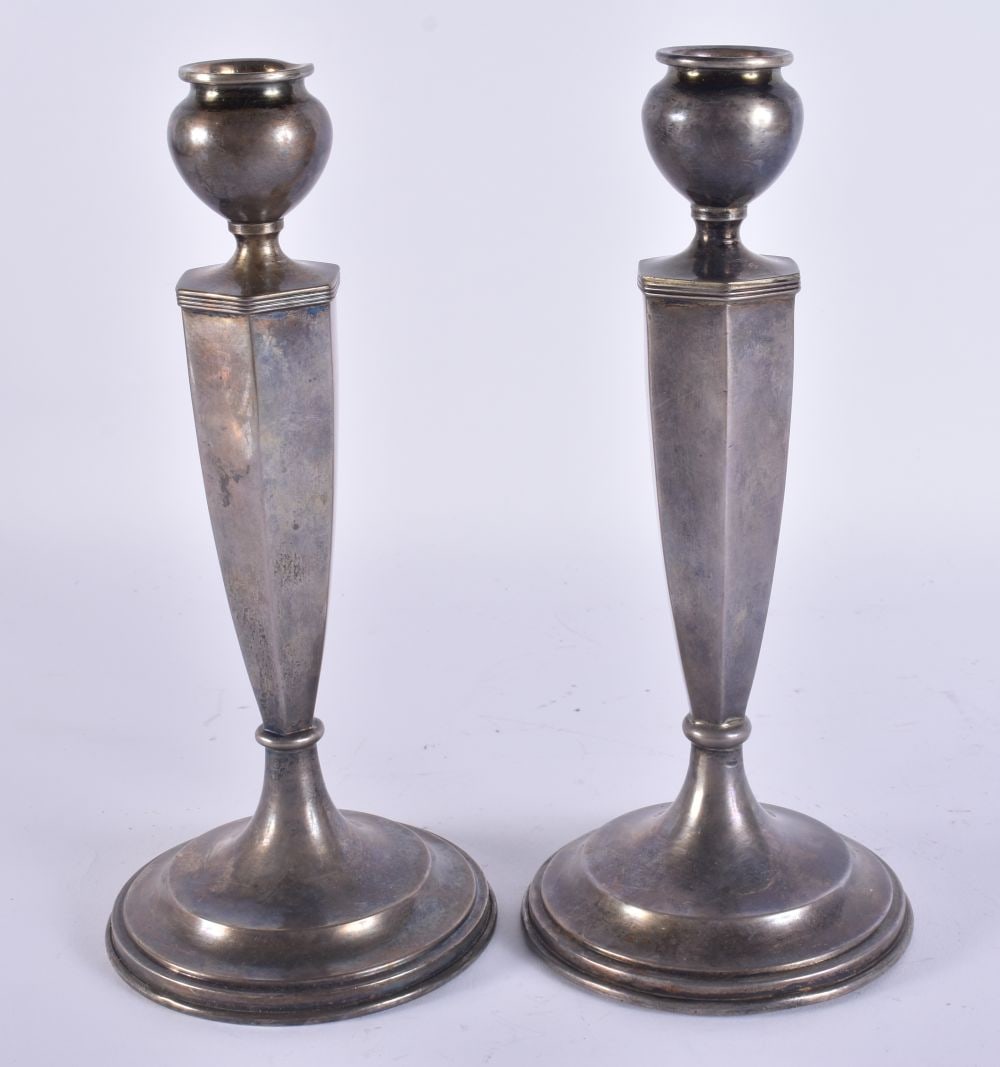 A PAIR OF SILVER CANDLESTICKS. 900 grams overall. 24 cm high. (1 of 5)