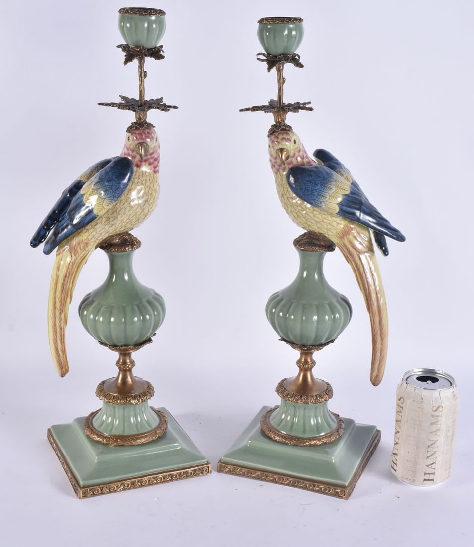 A PAIR OF CONTINENTAL POTTERY PARROT CANDLESTICKS. 47 cm high.: A PAIR OF CONTINENTAL POTTERY PARROT CANDLESTICKS. 47 cm high.