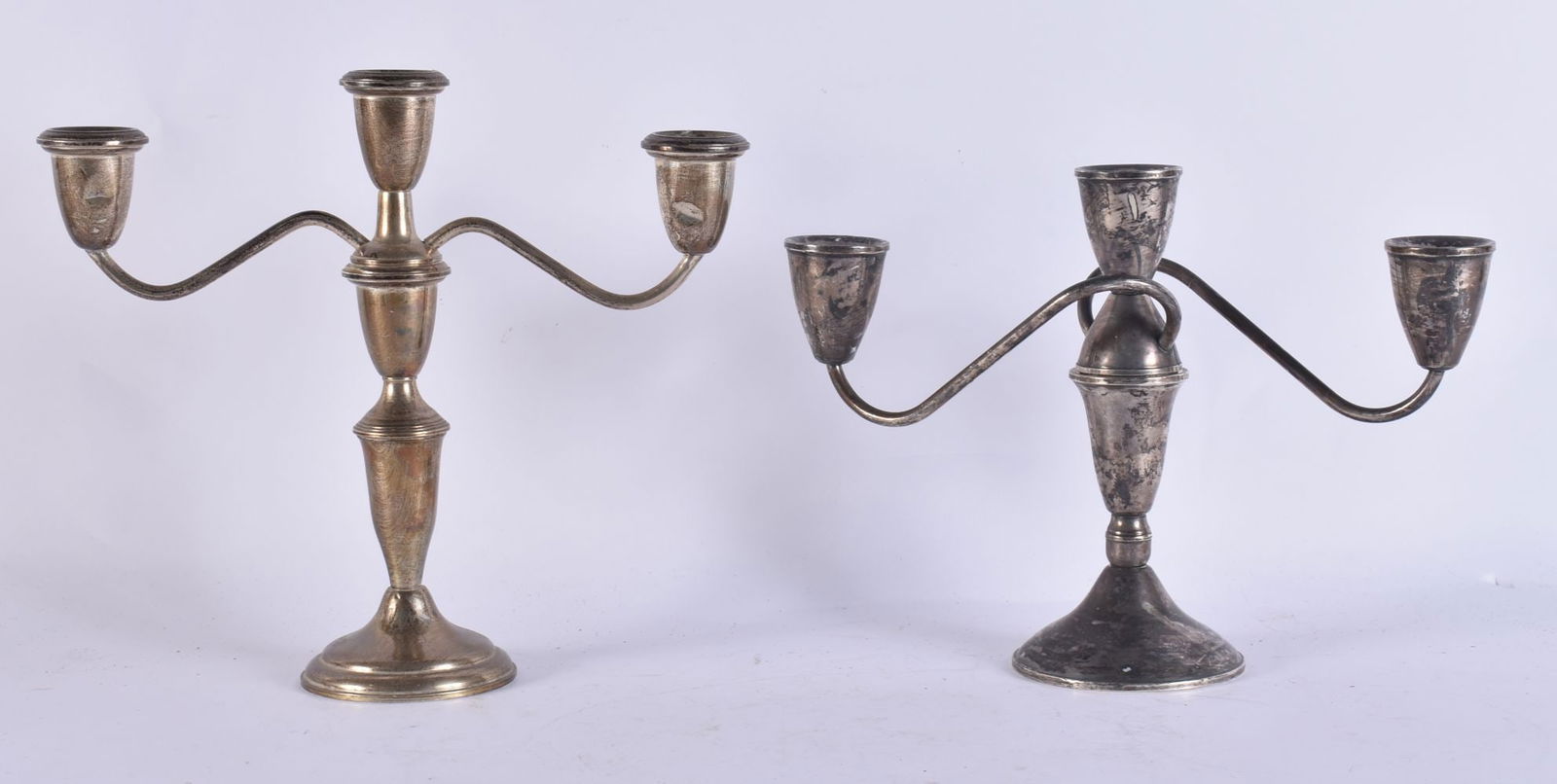 TWO SILVER CANDLESTICKS. 1250 grams overall. Largest 25cm x 18cm. (2) (1 of 4)