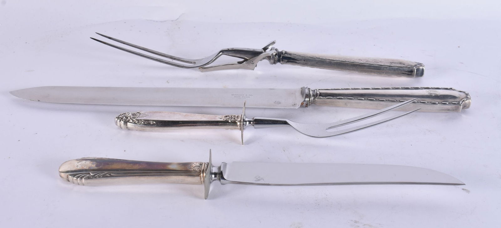 TWO PAIRS OF SILVER HANDLED SERVING UTENSILS. Largest 36 cm long. (4) (1 of 5)