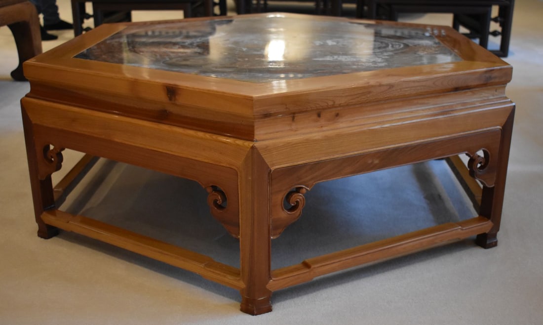 A CHINESE HEXAGONAL CARVED WOOD TABLE inset with a lacquered panel. 116 cm x 43 cm.: A CHINESE HEXAGONAL CARVED WOOD TABLE inset with a lacquered panel. 116 cm x 43 cm.