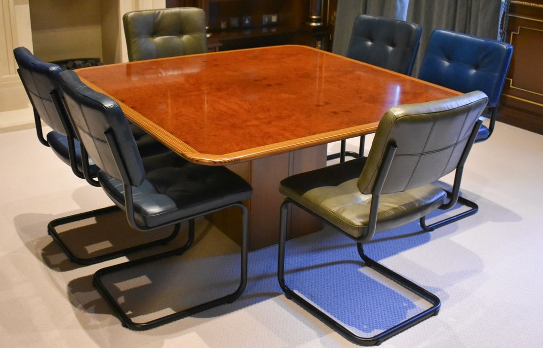 A FINE BURR WALNUT CROSSBANDED SQUARE FORM TABLE with six leather chairs. 140 cm square x 58cm. (7) (1 of 8)