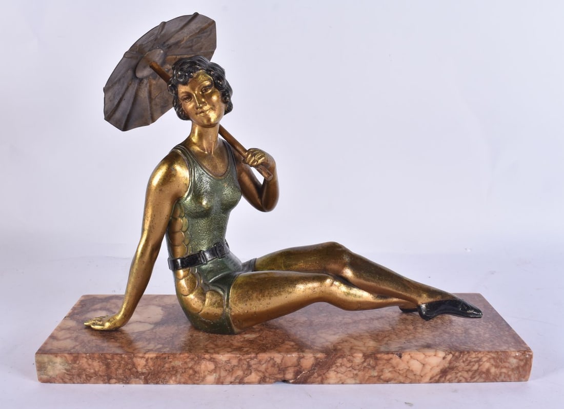 AN ART DECO COLD PAINTED SPELTER FIGURE OF A FEMALE. 28cm x 23 cm.: AN ART DECO COLD PAINTED SPELTER FIGURE OF A FEMALE. 28cm x 23 cm.