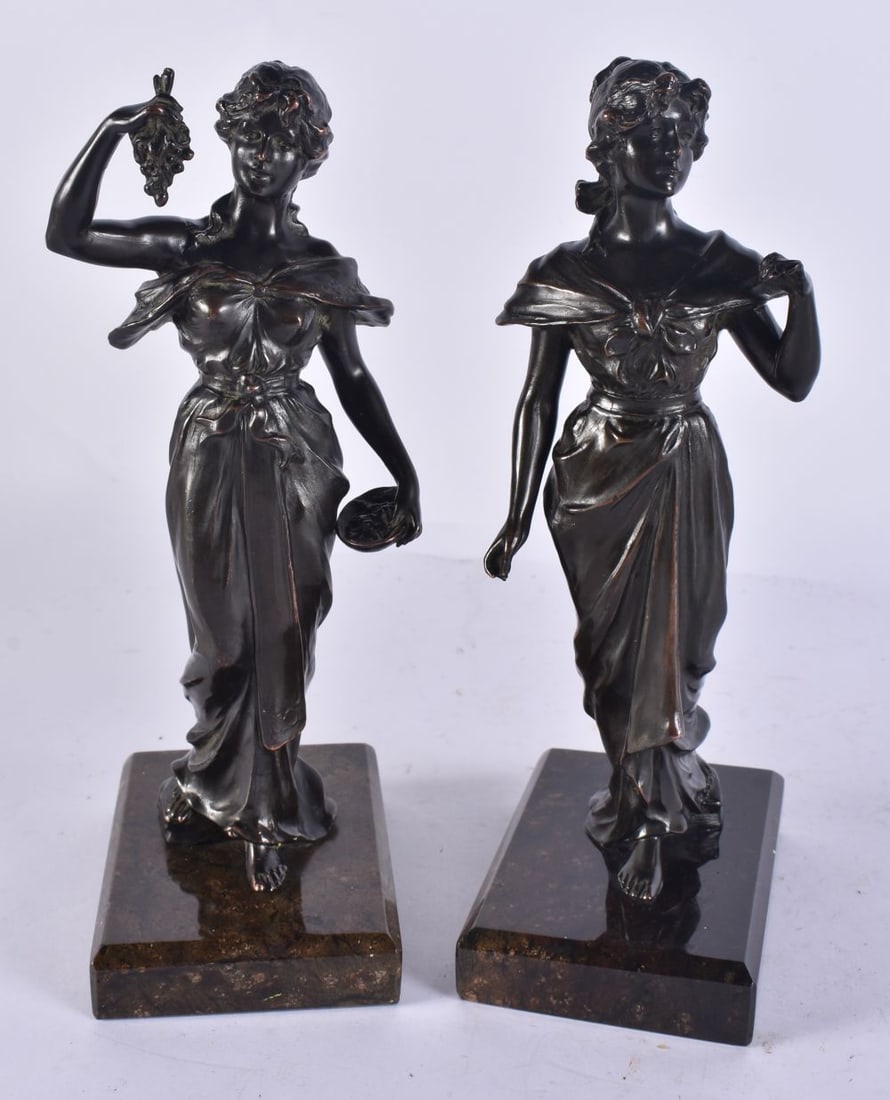 A PAIR OF ANTIQUE SPELTER FIGURES modelled upon stone plinths. 21.5 cm HIGH. (1 of 7)