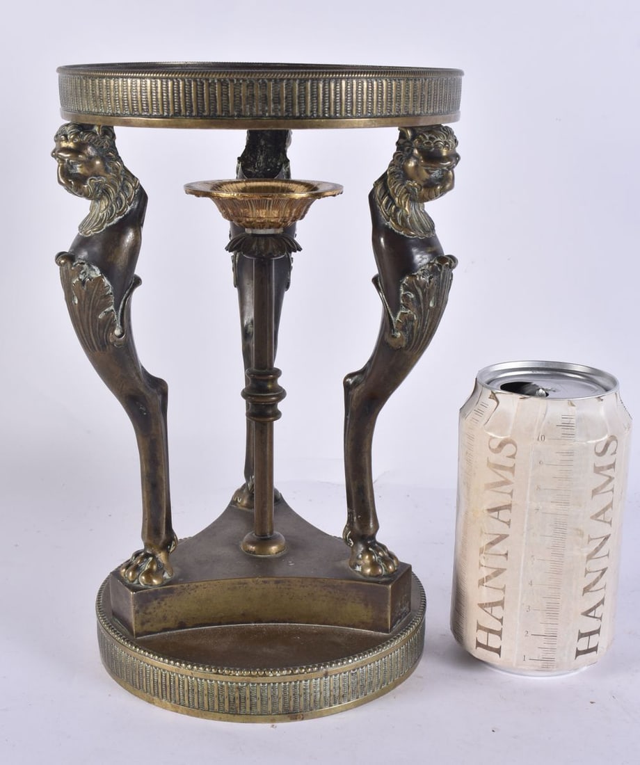 AN EARLY 19TH CENTURY BRONZE GRAND TOUR COMPORT BASE formed with lion mask heads. 13 cm x 13 cm.: AN EARLY 19TH CENTURY BRONZE GRAND TOUR COMPORT BASE formed with lion mask heads. 13 cm x 13 cm.