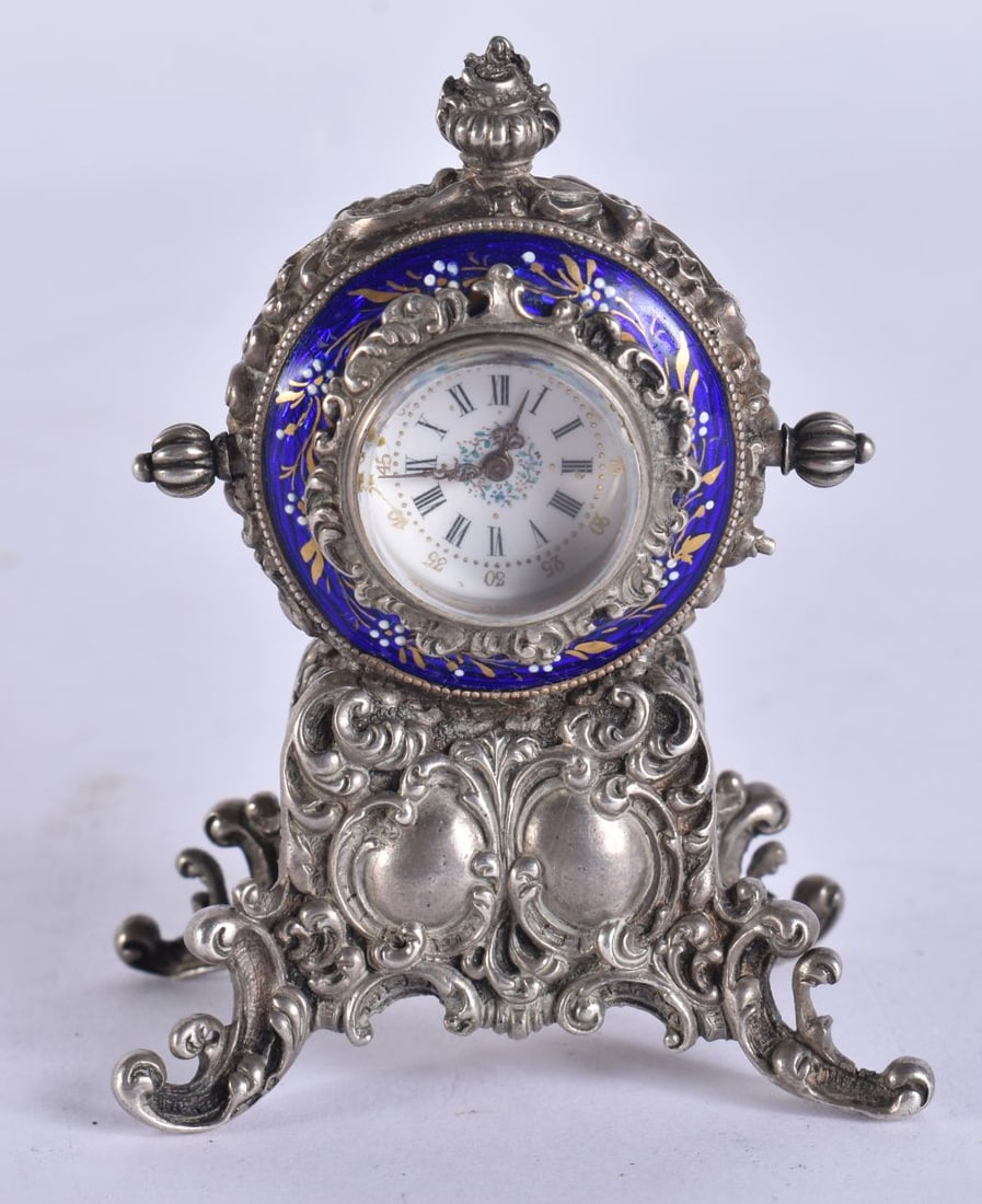 A SMALL ANTIQUE CONTINENTAL SILVER AND ENAMEL CLOCK. Running. 93 grams overall. 6.75 cm x 4.75 cm. (1 of 7)