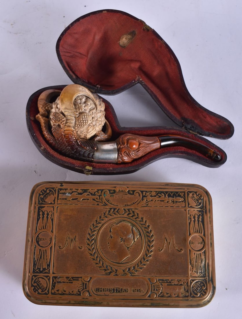 A WW1 CHRISTMAS TIN together with a Meerschaum pipe. Largest 15 cm wide. (2) (1 of 8)