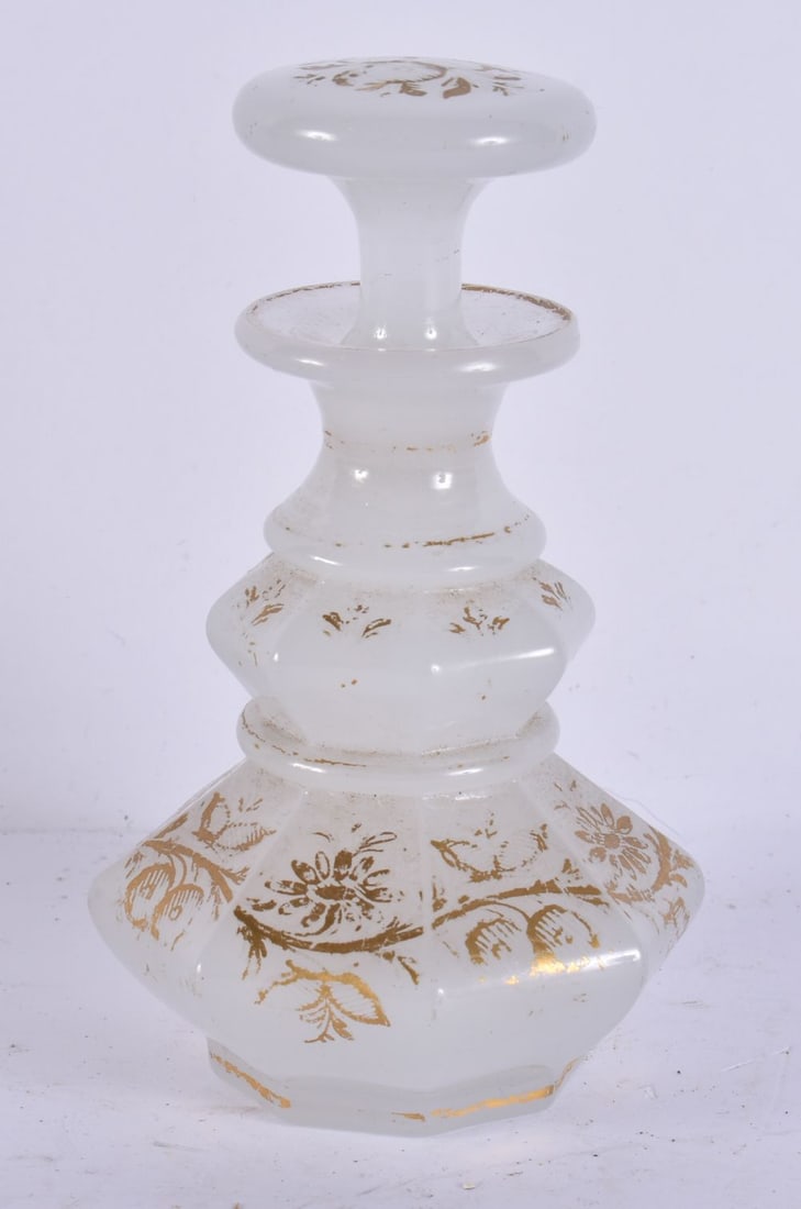 A VICTORIAN OPALINE GILDED GLASS SCENT BOTTLE AND STOPPER. 12.75 cm high. (1 of 3)