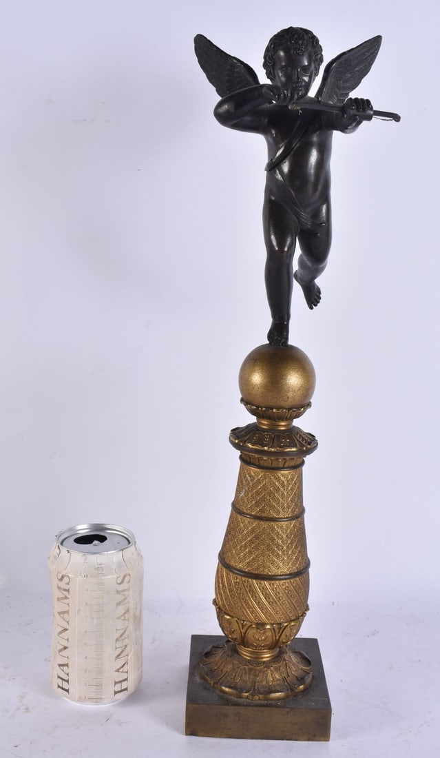 A LARGE 19TH CENTURY FRENCH BRONZE AND GILT BRONZE CHERUB ON STAND. 44 cm high.: A LARGE 19TH CENTURY FRENCH BRONZE AND GILT BRONZE CHERUB ON STAND. 44 cm high.