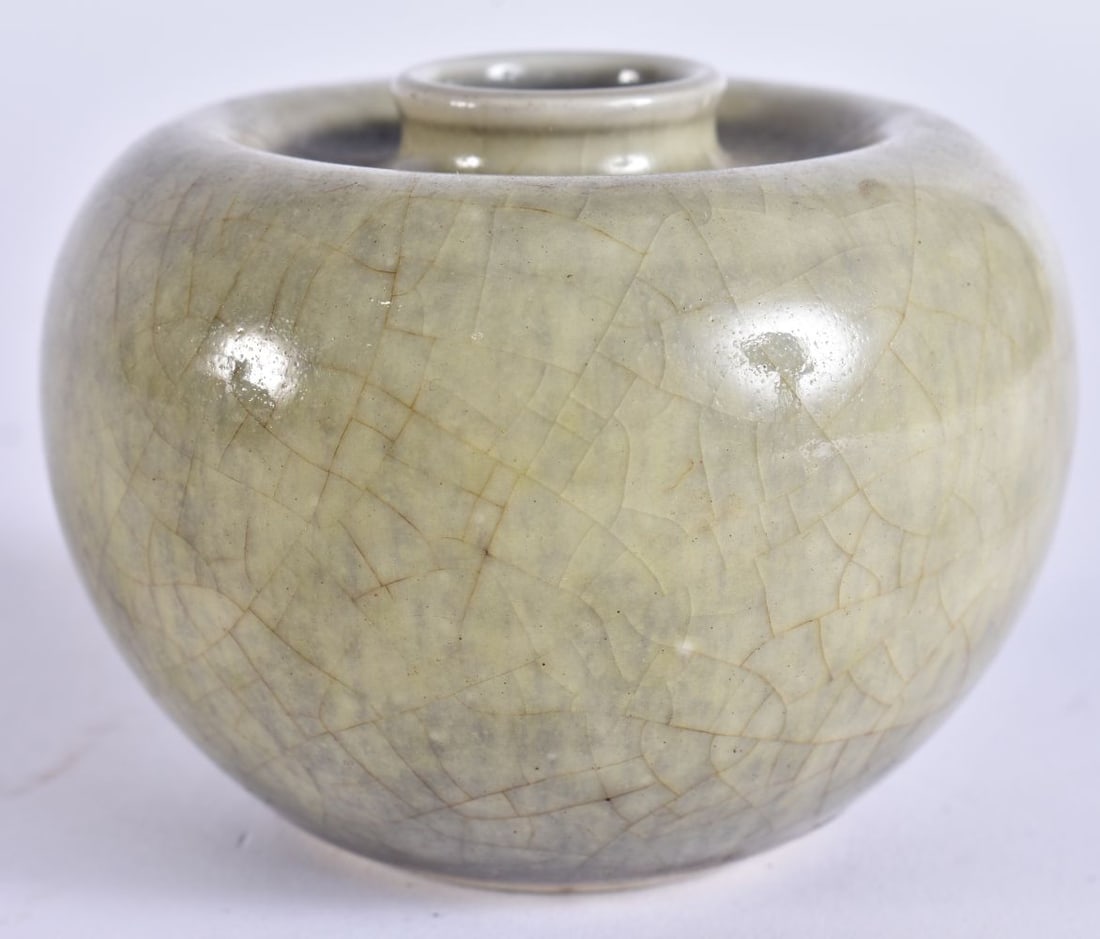 A CHINESE QING DYNASTY OLIVE MONOCHROME PORCELAIN ZUN BRUSH WASHER. 7.5 cm wide.: A CHINESE QING DYNASTY OLIVE MONOCHROME PORCELAIN ZUN BRUSH WASHER. 7.5 cm wide.