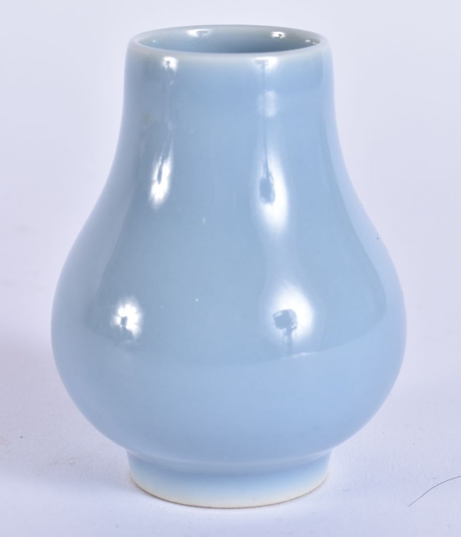 A CHINESE BLUE MONOCHROME PORCELAIN MINIATURE SCHOLARS VASE. 6.75 cm high. (1 of 4)
