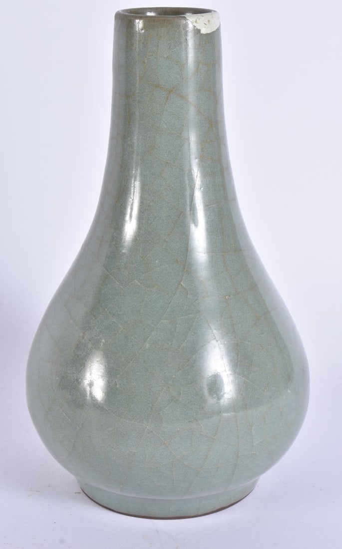 A CHINESE QING DYNASTY MONOCHROME RU WARE VASE of bulbous form. 19.5 cm high. (1 of 4)