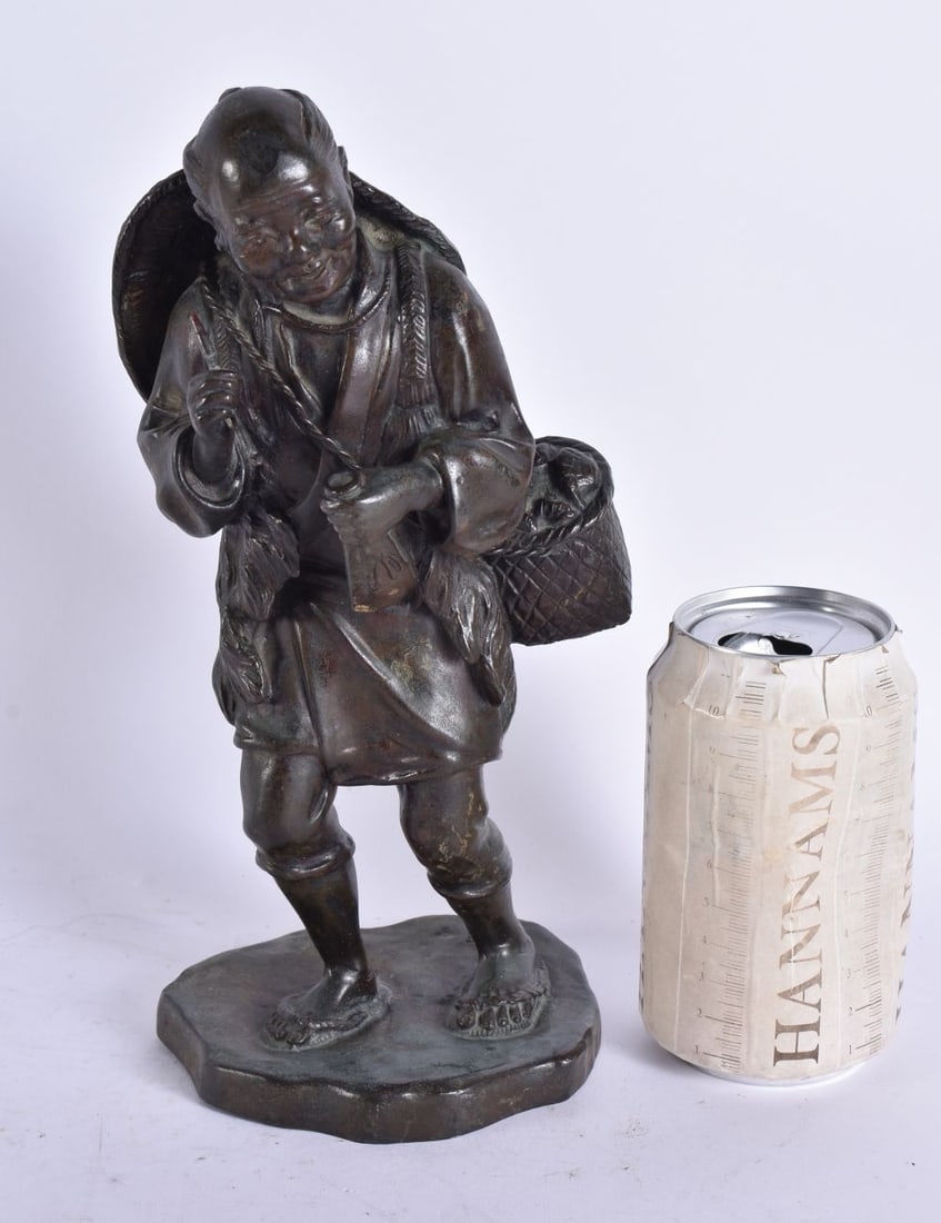 A 19TH CENTURY JAPANESE MEIJI PERIOD BRONZE OKIMONO modelled as a male smoking a pipe. 26 cm high.: A 19TH CENTURY JAPANESE MEIJI PERIOD BRONZE OKIMONO modelled as a male smoking a pipe. 26 cm high.