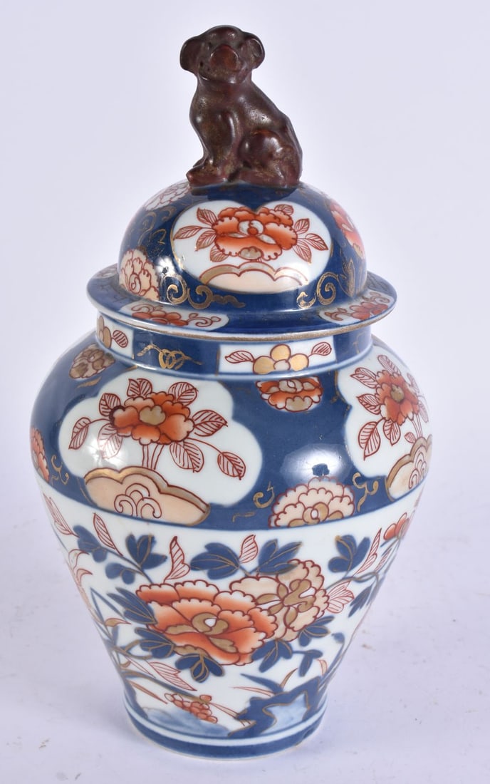 AN 18TH CENTURY JAPANESE EDO PERIOD IMARI PORCELAIN VASE AND COVER painted with flowers. 28cm high. (1 of 5)