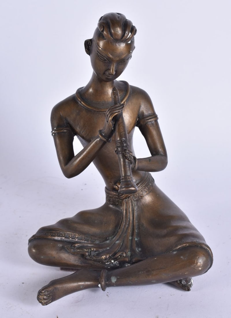 AN INDIAN BRONZE FIGURE OF A MUSICIAN. 21 cm high.: AN INDIAN BRONZE FIGURE OF A MUSICIAN. 21 cm high.