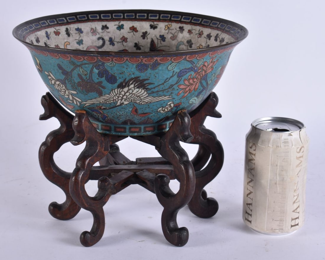 A 19TH CENTURY JAPANESE MEIJI PERIOD CLOISONNE ENAMEL BOWL decorated with birds and foliage. 23 cm w: A 19TH CENTURY JAPANESE MEIJI PERIOD CLOISONNE ENAMEL BOWL decorated with birds and foliage. 23 cm wide.