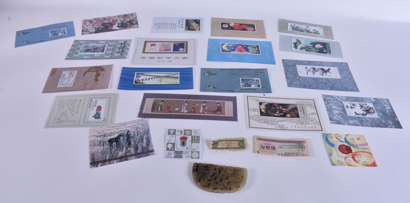 A CHINESE QING DYNASTY JADE together with stamps. (qty) (1 of 9)