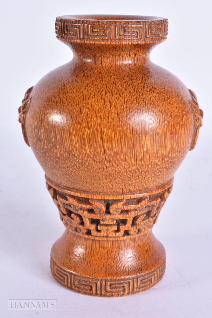 A CHINESE CARVED BUFFALO HORN TYPE VASE. 15 cm high.: A CHINESE CARVED BUFFALO HORN TYPE VASE. 15 cm high.