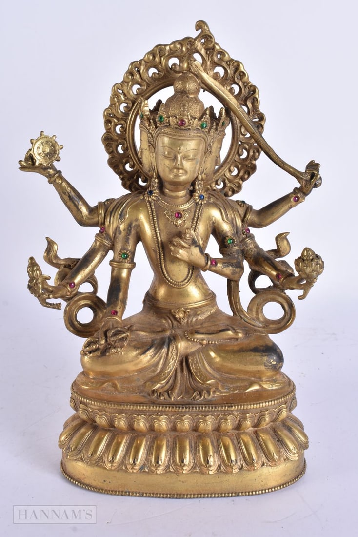 A CHINESE TIBETAN GILT BRONZE JEWELLED BUDDHA. 23.5 cm high. (1 of 6)