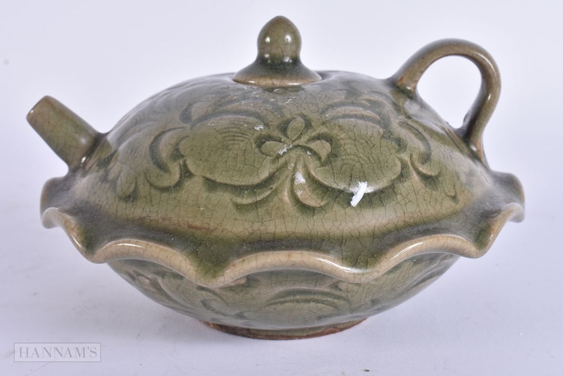 A CHINESE CELADON TEAPOT AND COVER. 15 cm wide. (1 of 5)