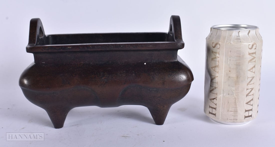 A CHINESE TWIN HANDLED BRONZE CENSER. 18.5 cm wide.: A CHINESE TWIN HANDLED BRONZE CENSER. 18.5 cm wide.