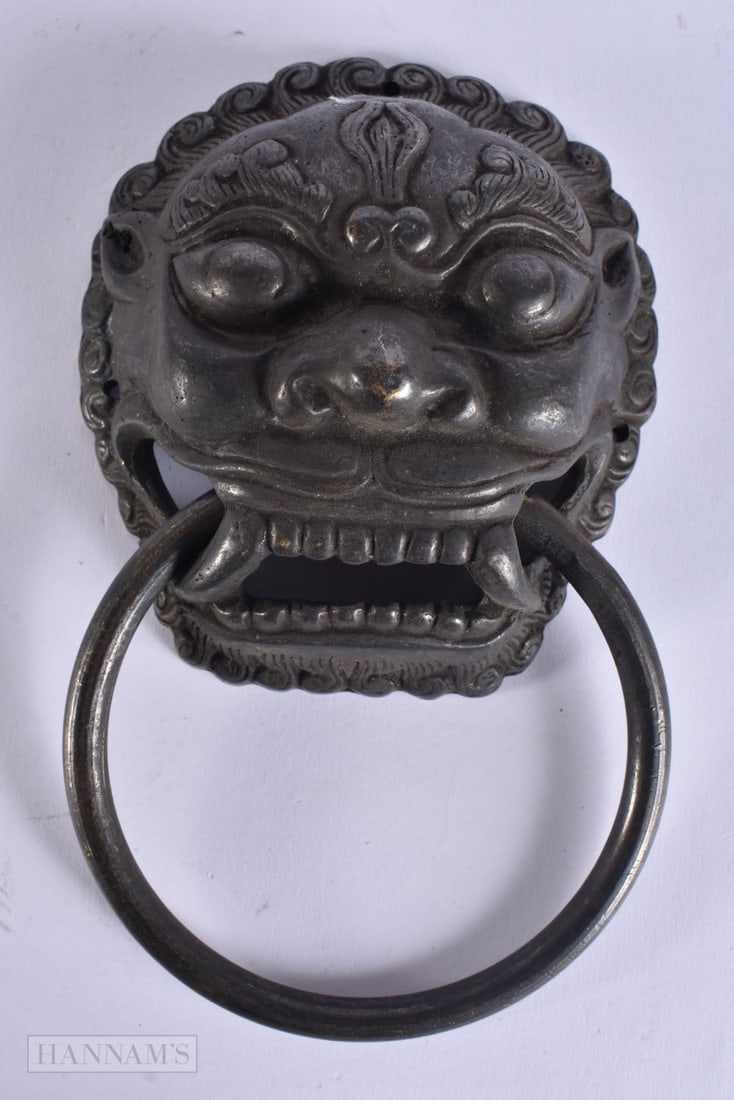 A CHINESE TIBETAN BRONZE DOOR KNOCKER. 18 cm long.: A CHINESE TIBETAN BRONZE DOOR KNOCKER. 18 cm long.