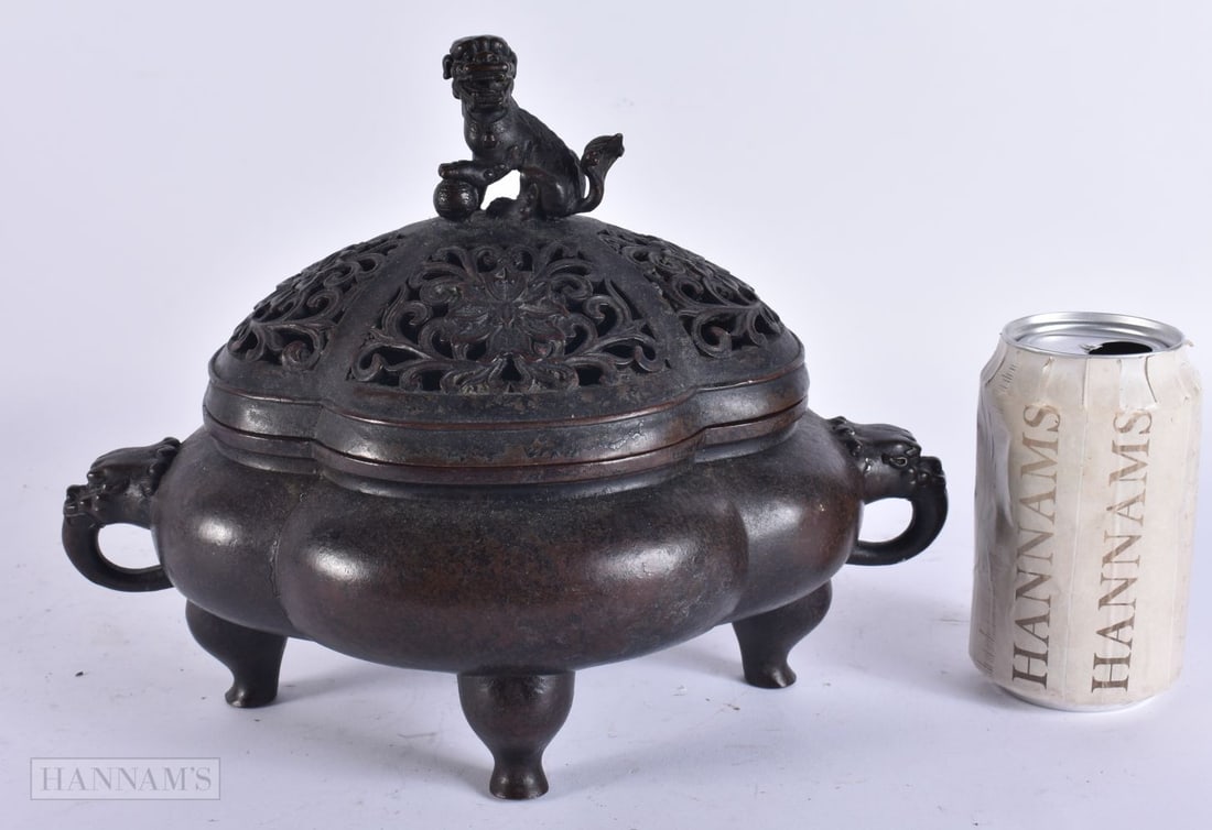 A CHINESE BRONZE CENSER AND COVER. 25 cm wide.: A CHINESE BRONZE CENSER AND COVER. 25 cm wide.