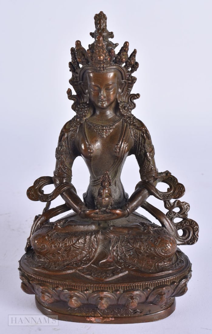 A CHINESE TIBETAN BRONZE BUDDHA. 15 cm high. (1 of 6)