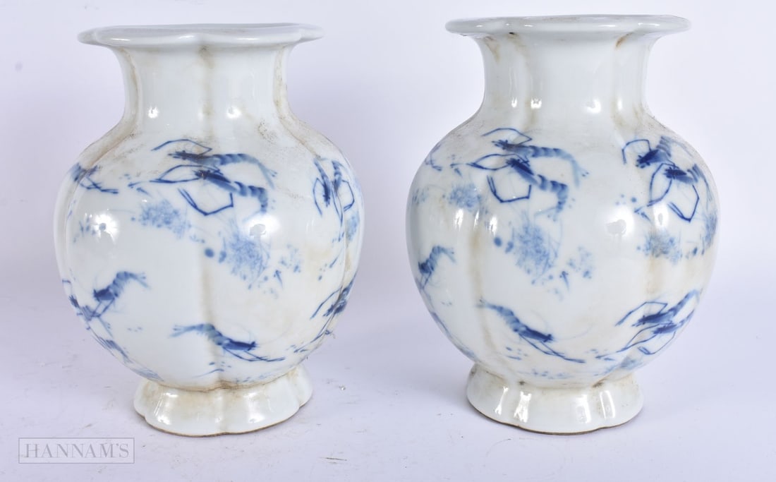 A PAIR OF CHINESE BLUE AND WHITE PORCELAIN VASES. 19 cm high. (1 of 5)