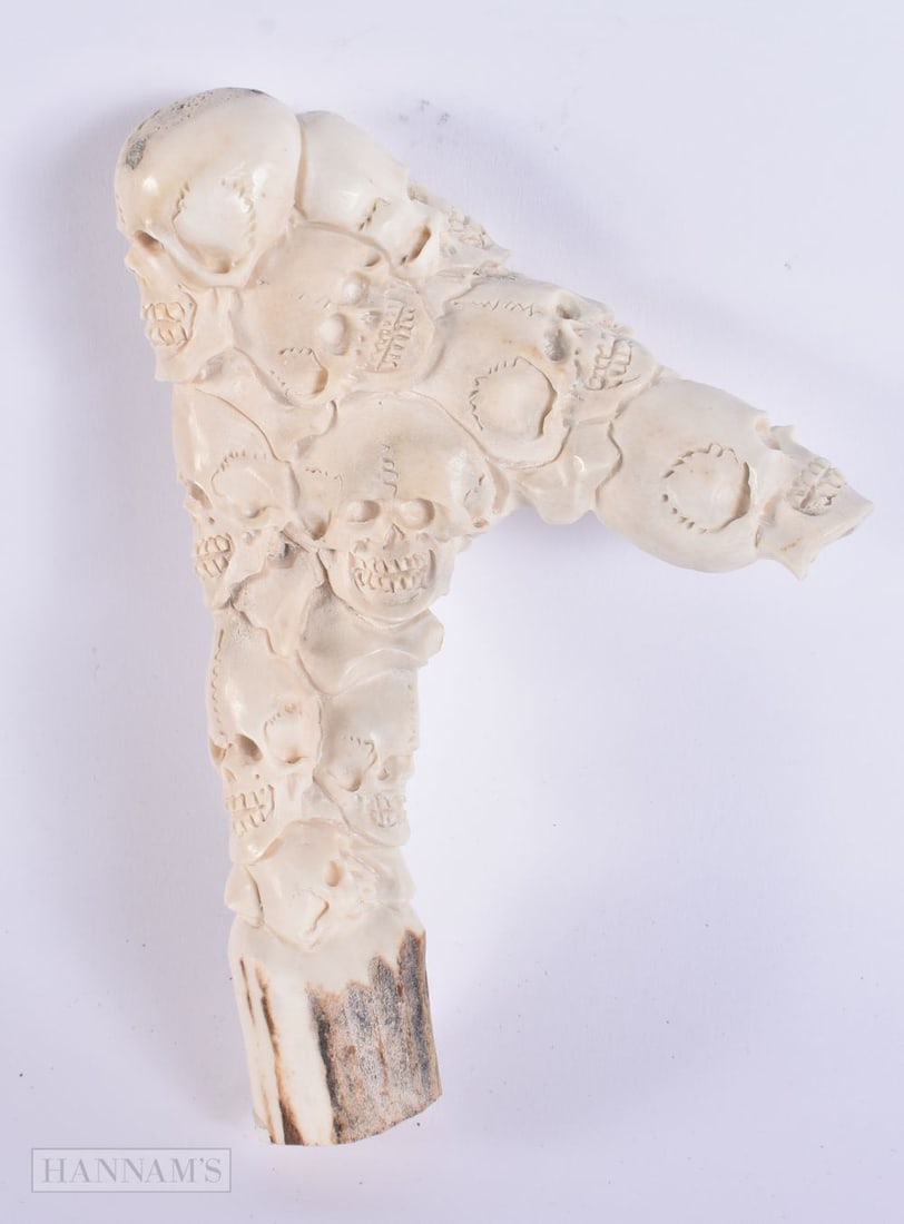 A MEMENTO MORI SKULL ANTLER HORN CANE HANDLE. 15 cm long.: A MEMENTO MORI SKULL ANTLER HORN CANE HANDLE. 15 cm long.
