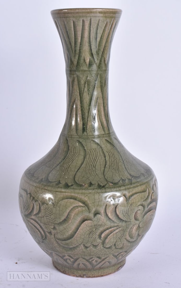 A CHINESE CELADON VASE. 24 cm high. (1 of 4)